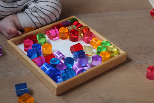 Lucent cylinders in wooden frame 64 Pieces
