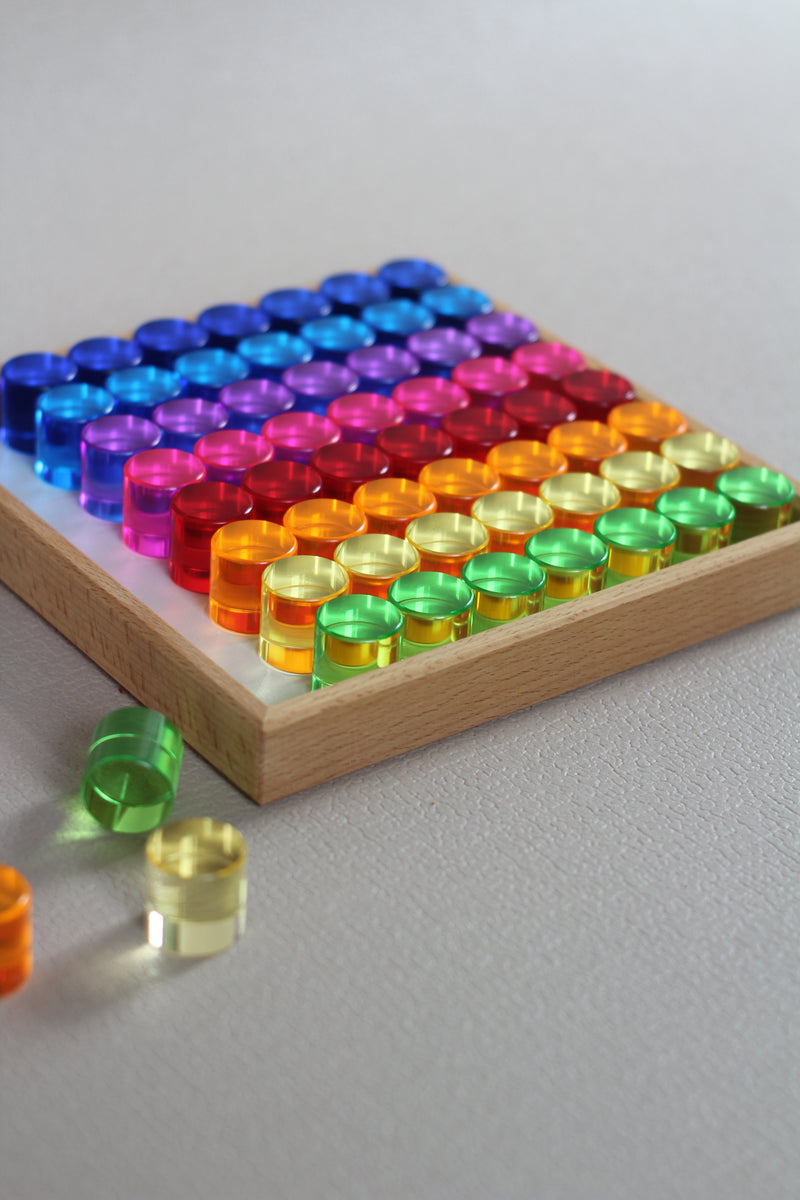 Lucent cylinders in wooden frame 64 Pieces