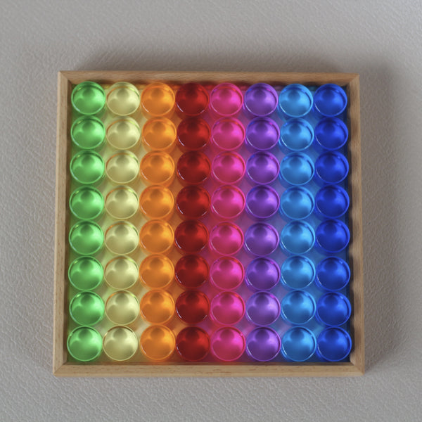 Lucent cylinders in wooden frame 64 Pieces